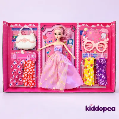 Princess Dress-Up Doll Gift Set opened: the doll with spare dresses, a bag and glasses in the tray.